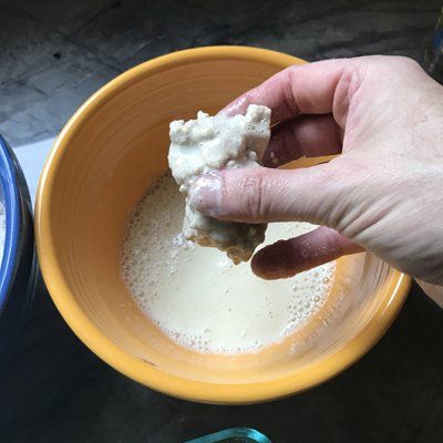 dipping tofu in wet ingredients