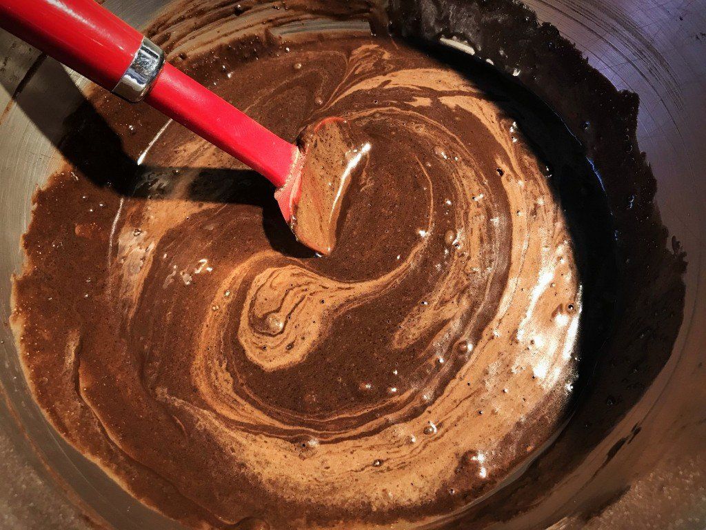 cake batter with vinegar being folded in