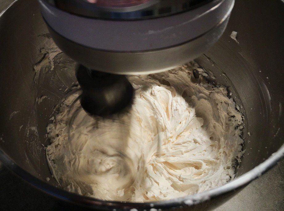 frosting in mixer being whipped
