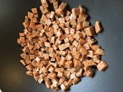 diced seitan in wok