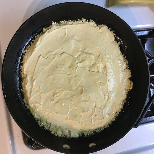 tofu omelette ingredients in cast iron skillet