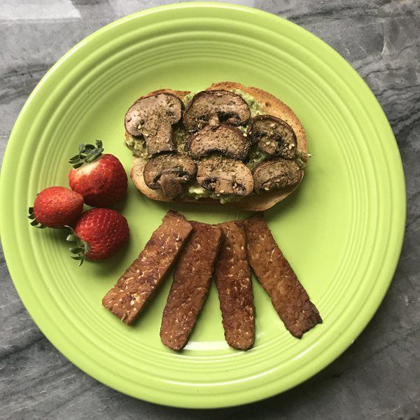 Tempeh Bacon on plate with avocado toast