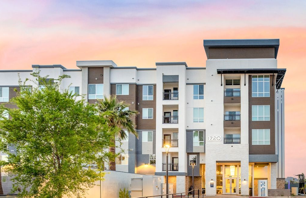 Modern apartment building with a driveway at sunset at Echo Biltmore in Phoenix, AZ..