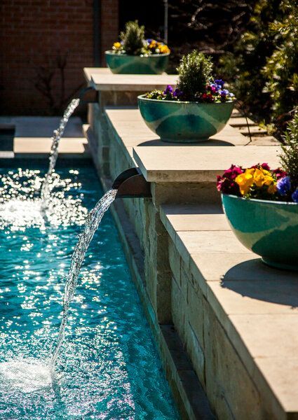 pool with fountains and planters
