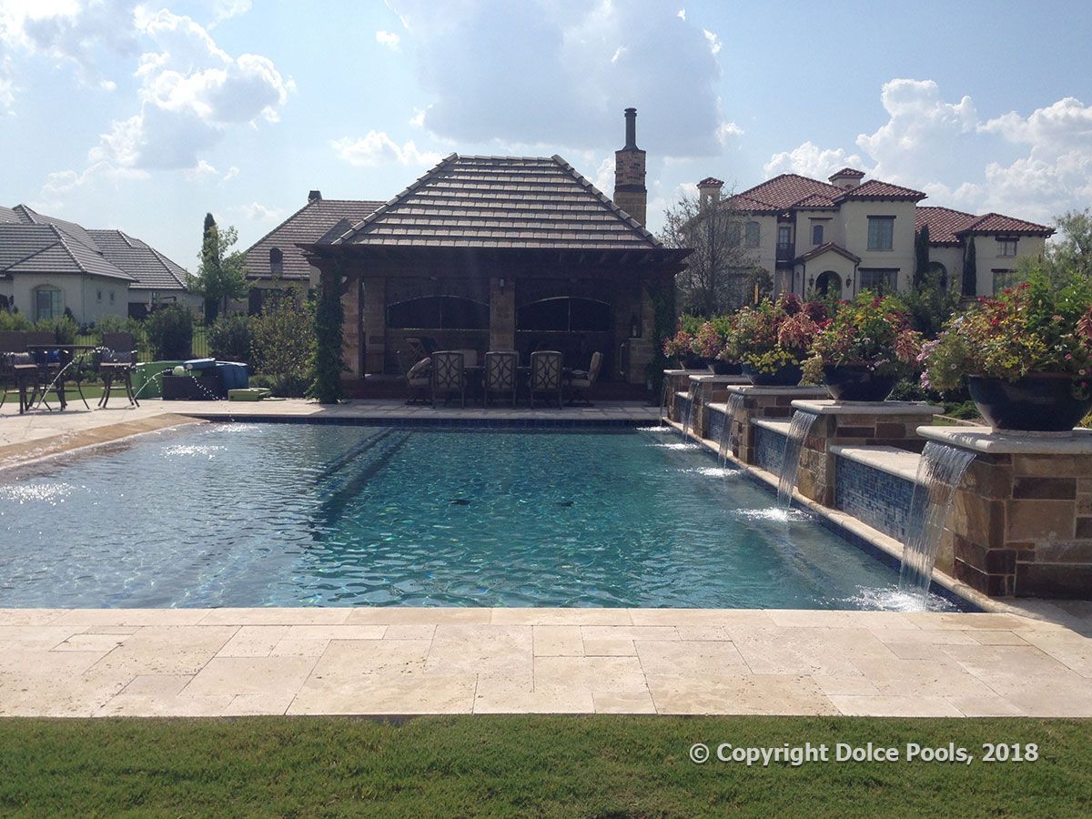large backyard pool with cabana