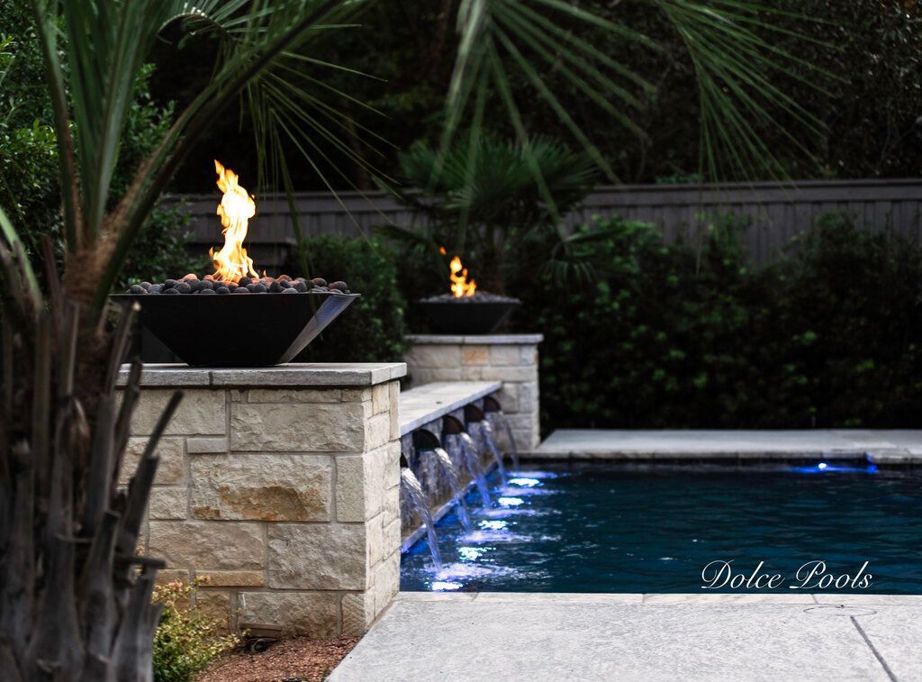 pool with firepits and waterfalls