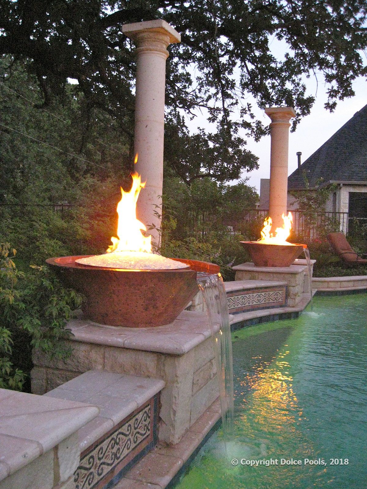custom pool with fire pits