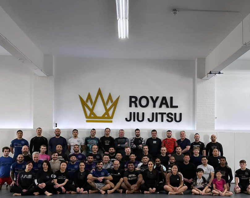 Adults drilling Brazilian Jiu-Jitsu technique at Royal Jiu-Jitsu Queens in Queens, NY for fitness and self-defense