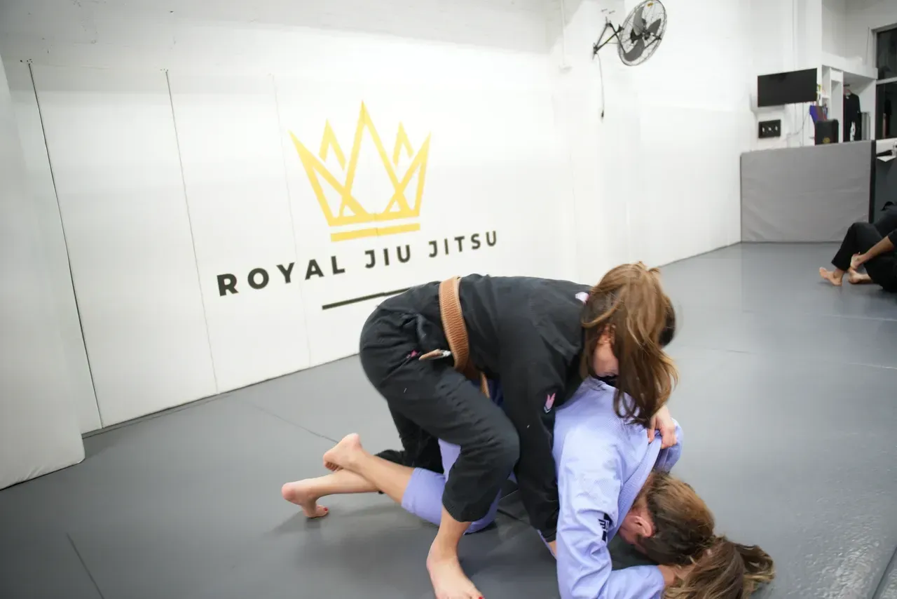 Students drilling brazilian jiu jitsu techniques at Royal Jiu-Jitsu Queens in Queens, NY for strength and confidence.