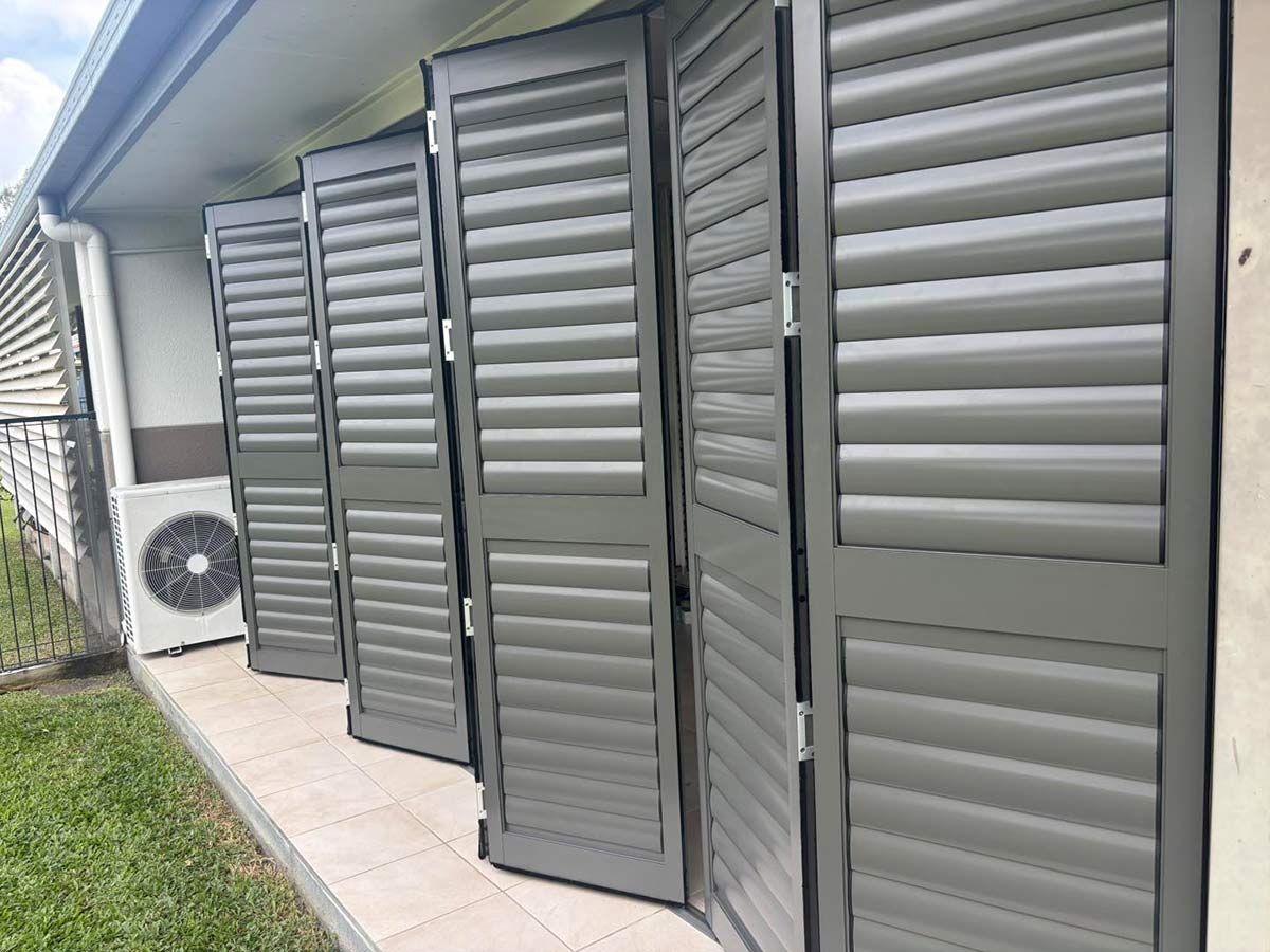 A Row of Shutters on the Side of a Building — Cover Me NQ in Currajong, QLD