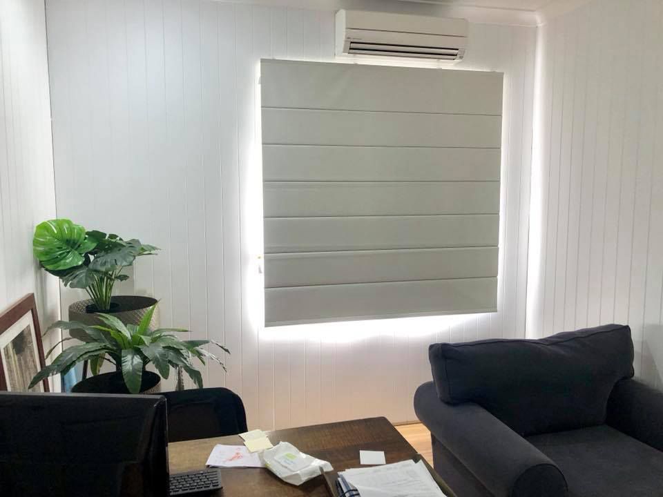 A Living Room With a Couch, Table, Chair and Window — Cover Me NQ in Currajong, QLD