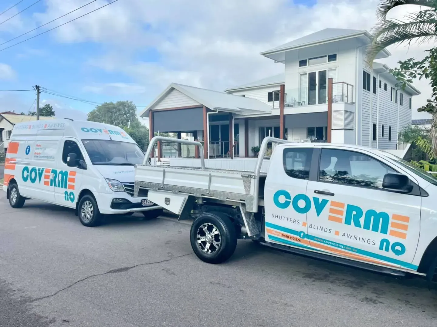 Two Trucks Are Parked in Front of a House — Cover Me NQ in Currajong, QLD