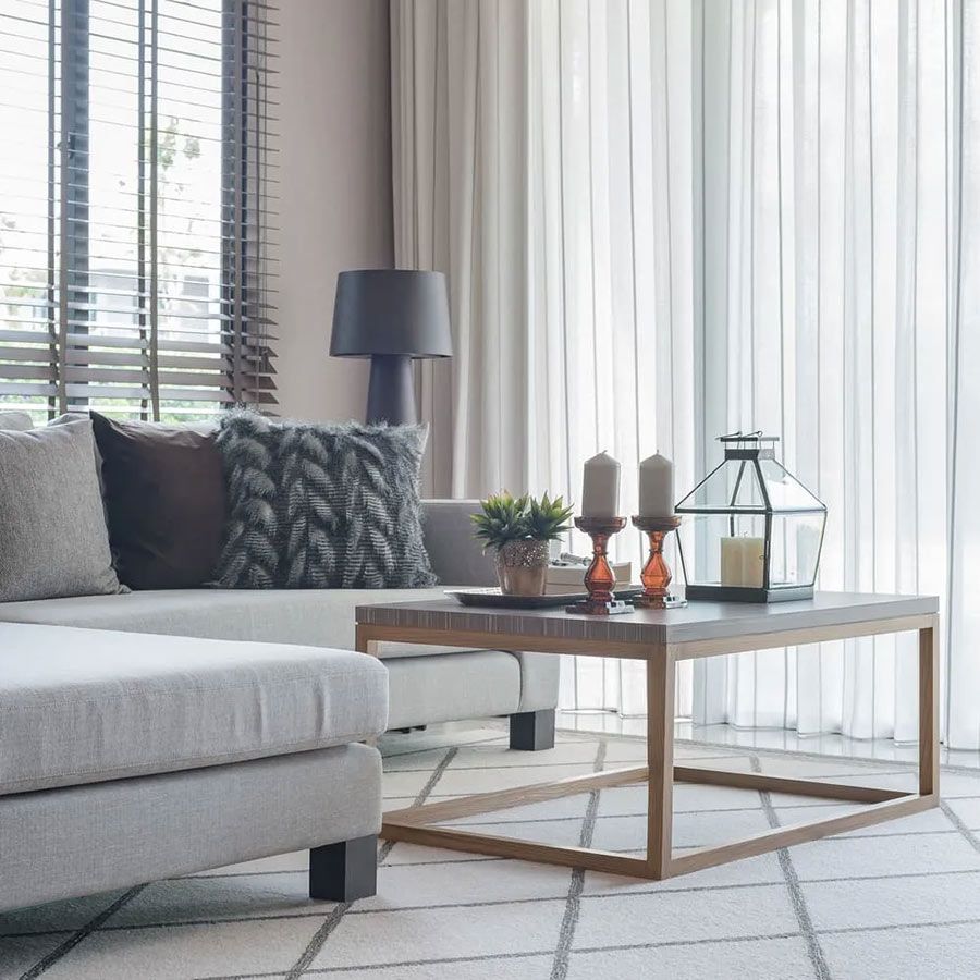 A Living Room With a Couch and a Coffee Table — Cover Me NQ in Currajong, QLD