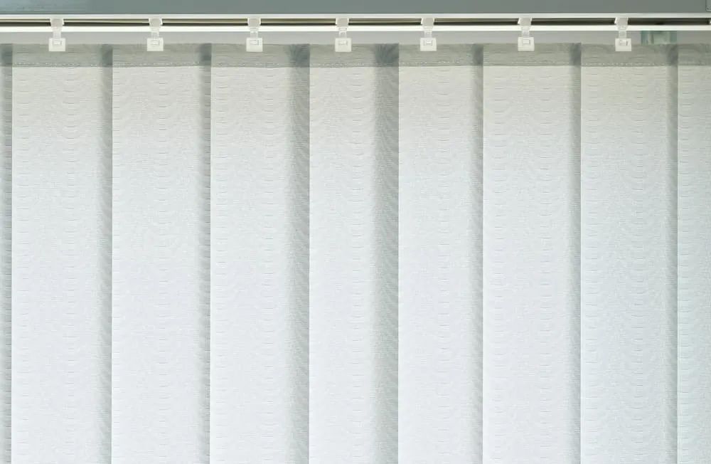 A Close Up of a White Vertical Blind on a Window — Cover Me NQ in Currajong, QLD
