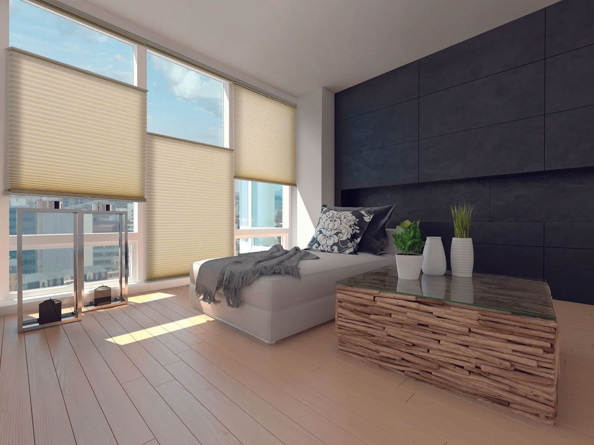 A Living Room With a Couch, Coffee Table, and Large Windows — Cover Me NQ in Currajong, QLD