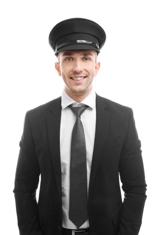 A man in a suit and tie is wearing a hat.