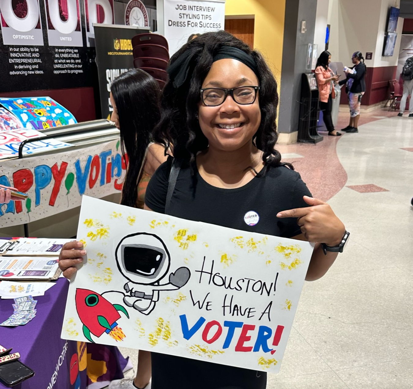 A college student proudly displays her 