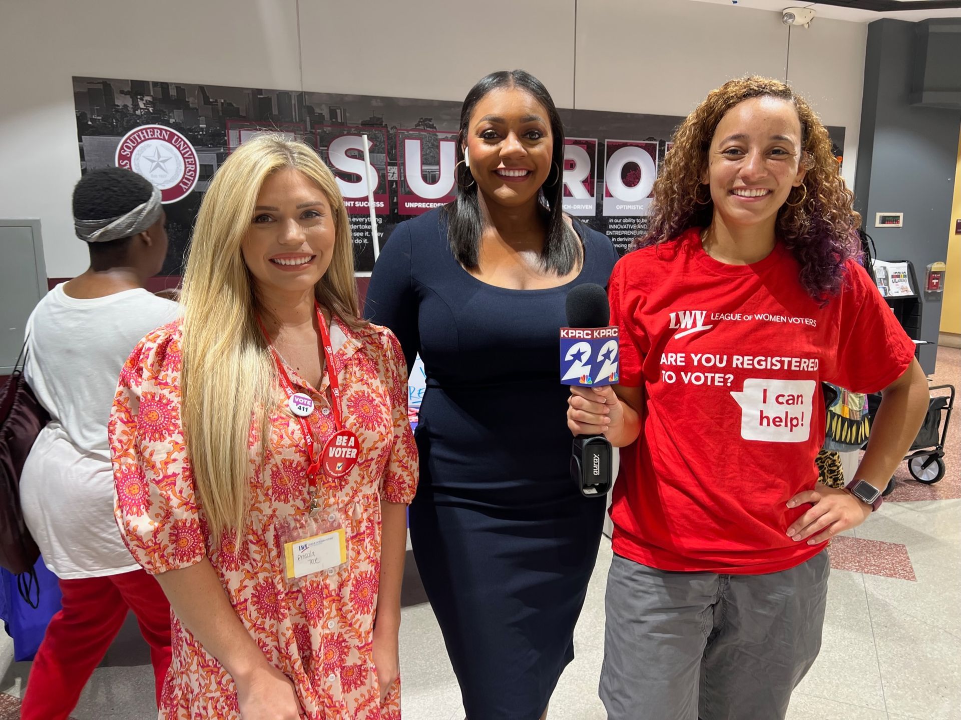 Three women about to appear on a news segment about the importance of registering to vote.