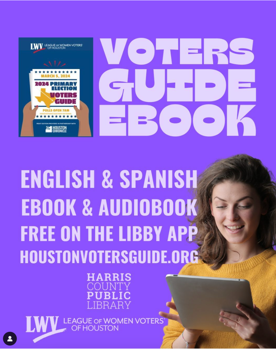 A woman is holding a tablet in front of a voter 's guide ebook