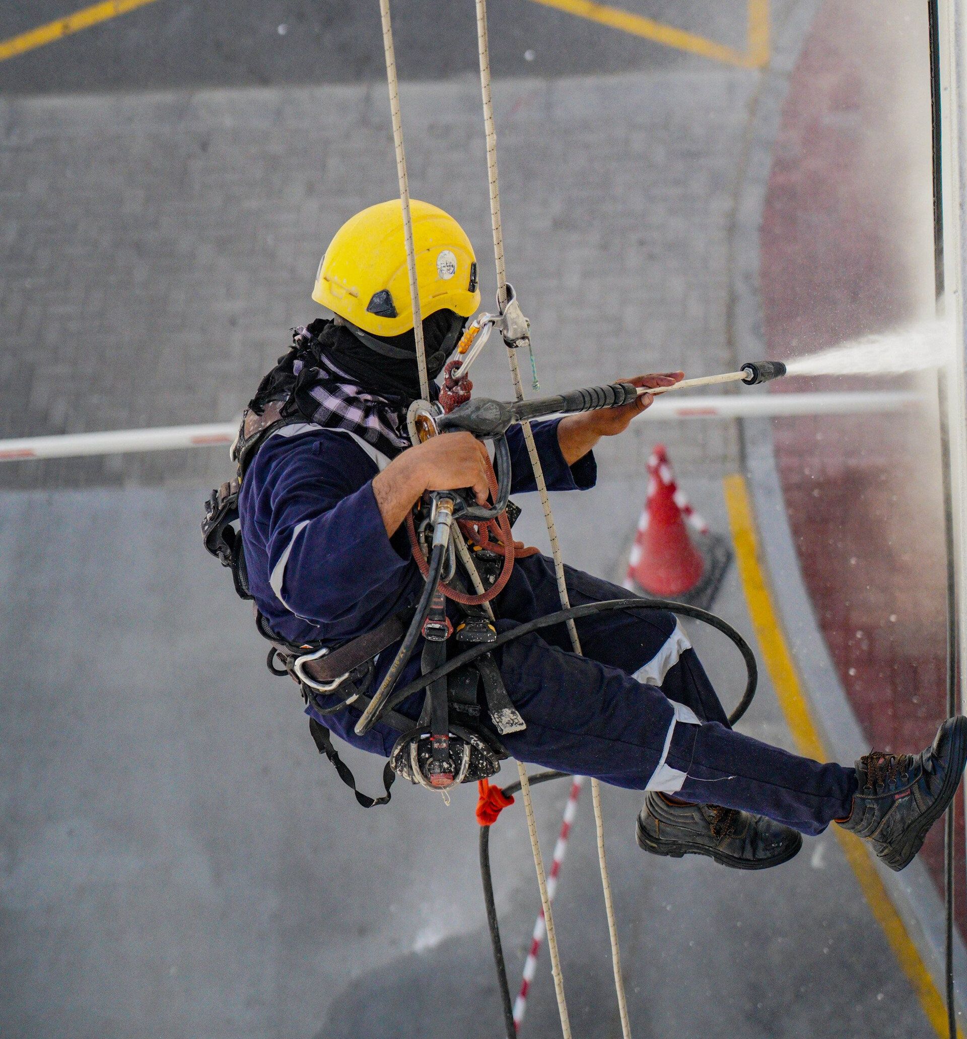 An exterior power washing service is in progress, rejuvenating the appearance of a business.