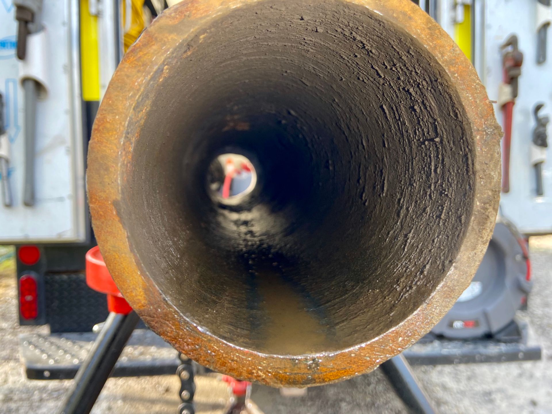 A close up of a metal pipe with a hole in the middle.