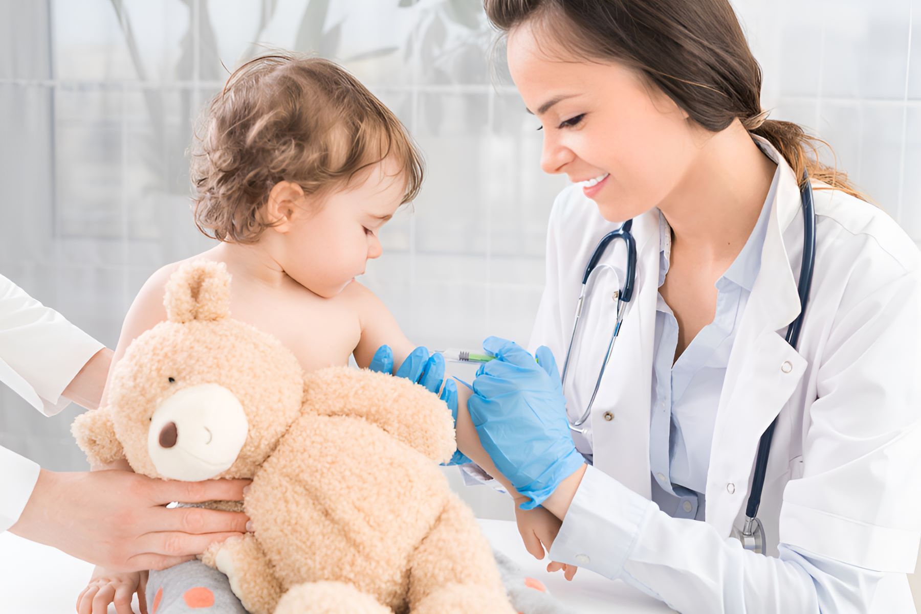 A Doctor is Giving a Child an Injection — Newcastle Paediatric Occupational Therapy in Charlestown, NSW