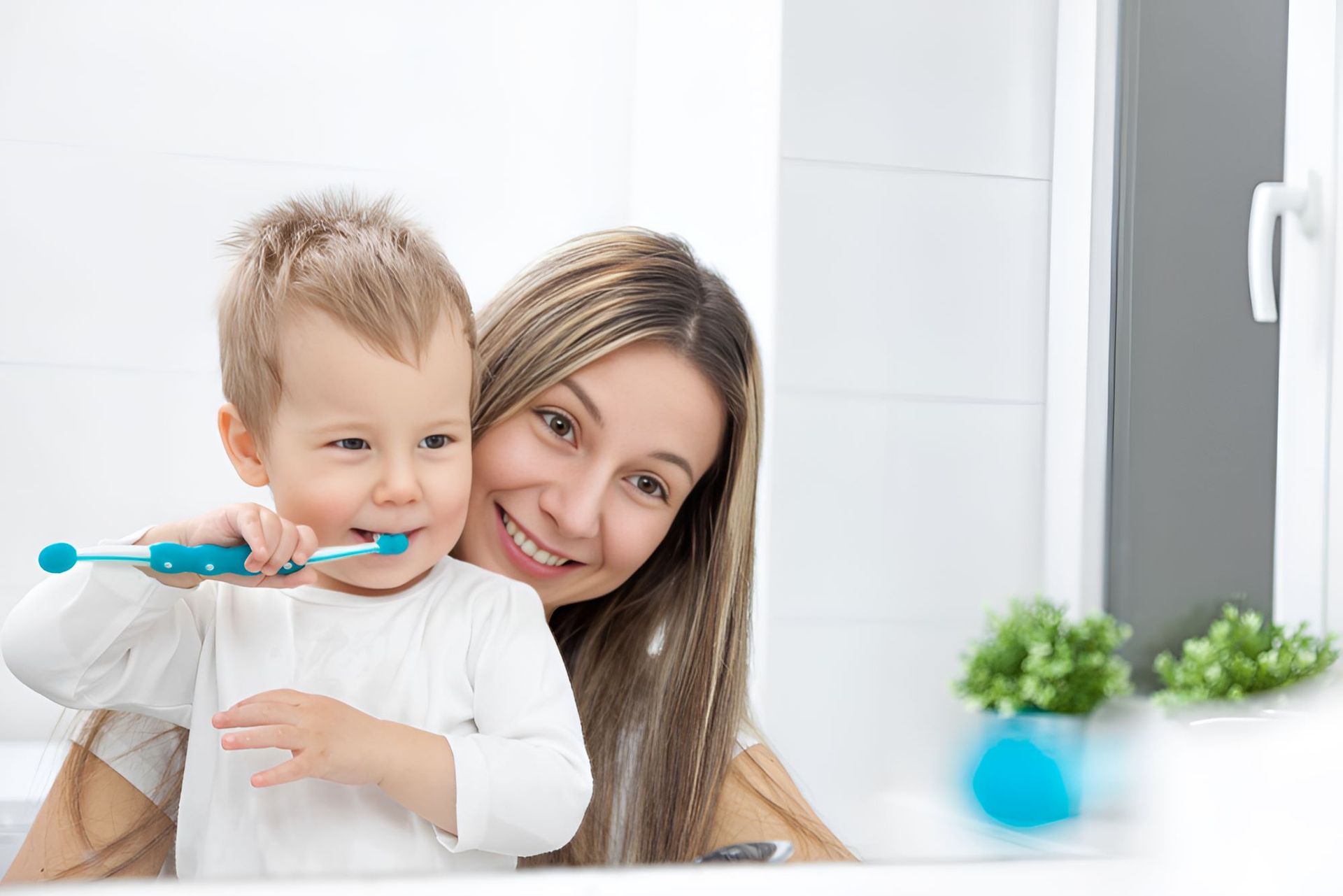 A Woman and a Child  Brushing his Teeth — Newcastle Paediatric Occupational Therapy in Floraville, NSW