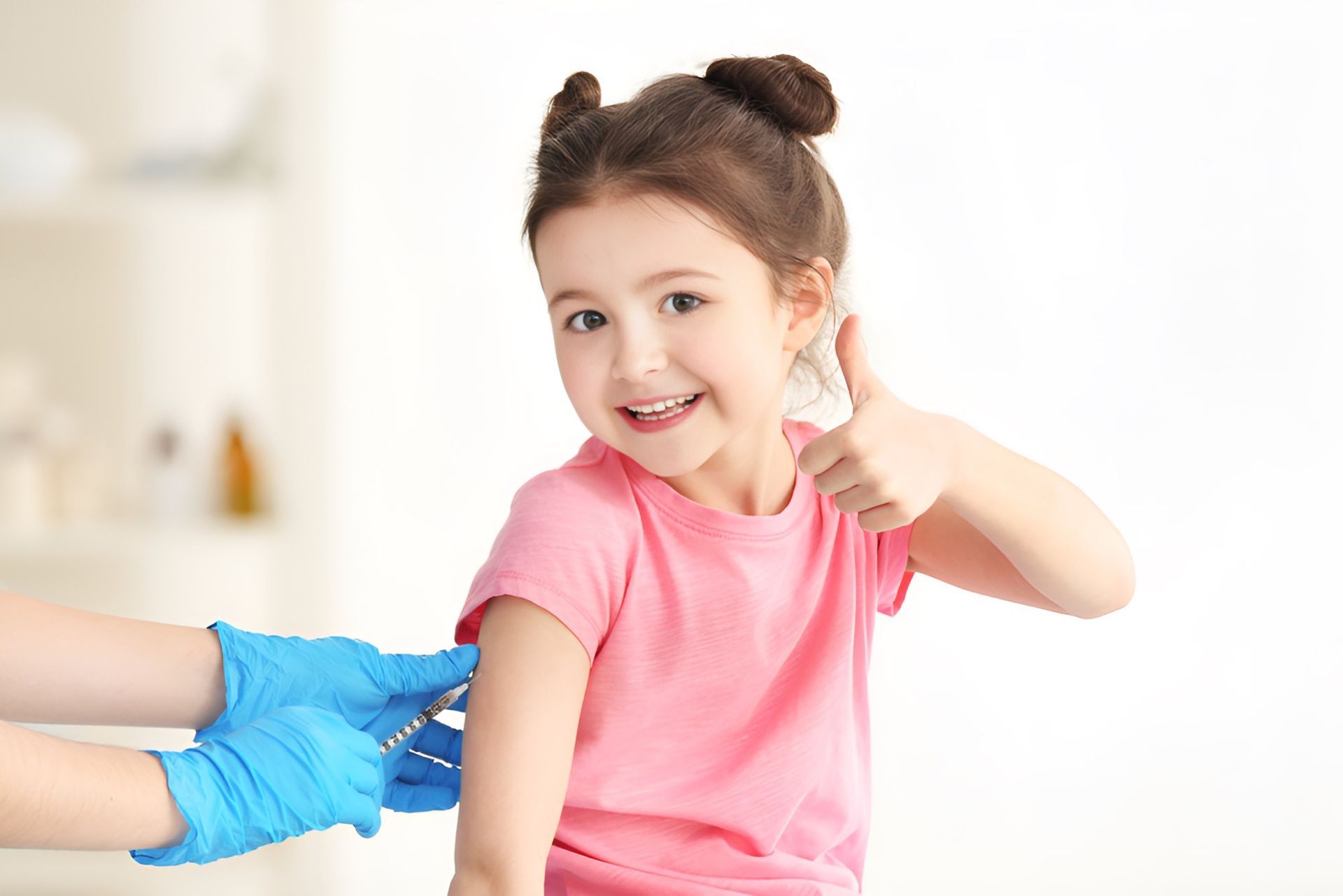 A Little Girl is Getting an Injection in Her Arm — Newcastle Paediatric Occupational Therapy In Floraville, NSW
