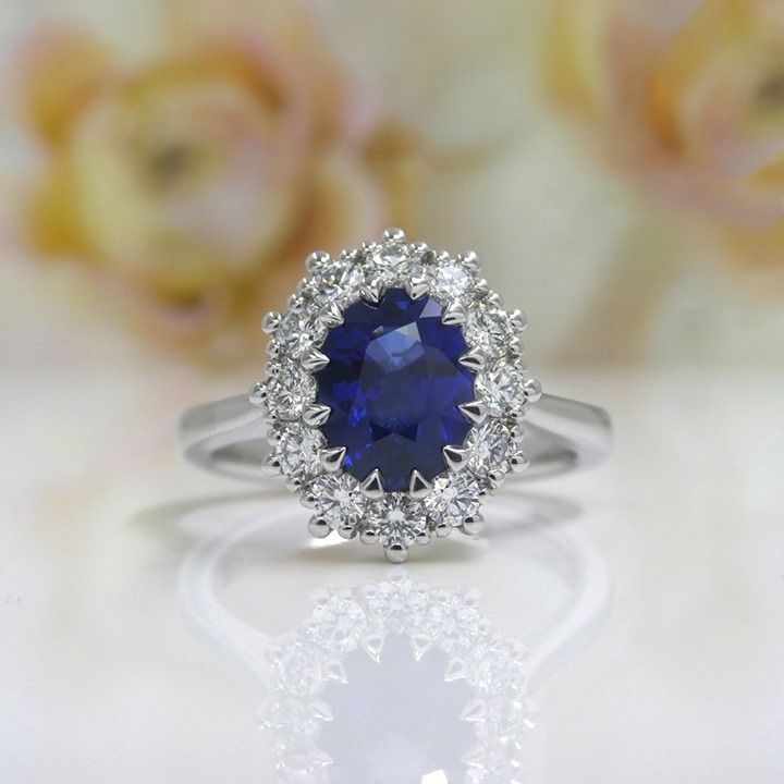 Kimberfire oval sapphire halo engagement ring