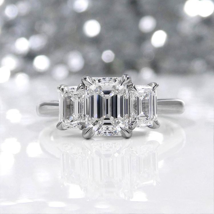 Kimberfire emerald three stone engagement ring