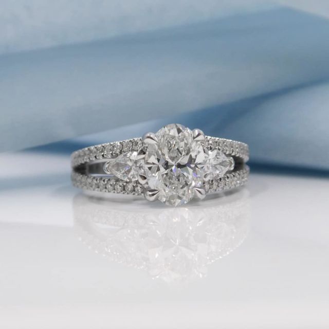 Kimberfire oval three stone split shank engagement ring