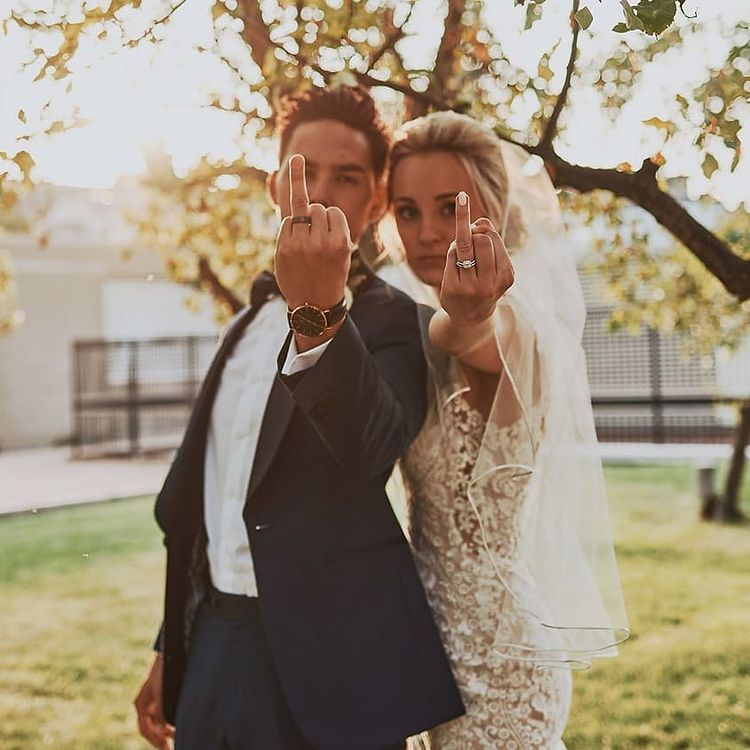 Kimberfire couple showing wedding bands.
