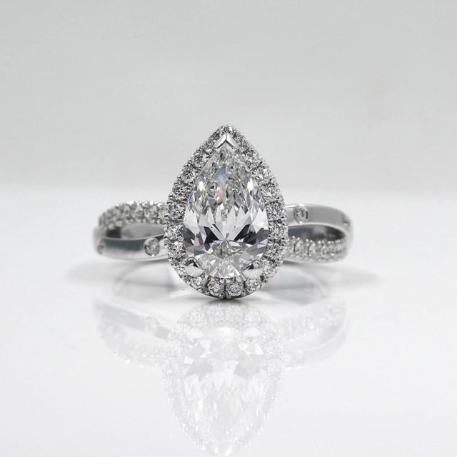 Kimberfire pear halo engagement ring