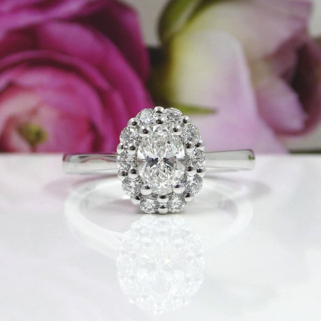 Kimberfire oval shared prong halo engagement ring