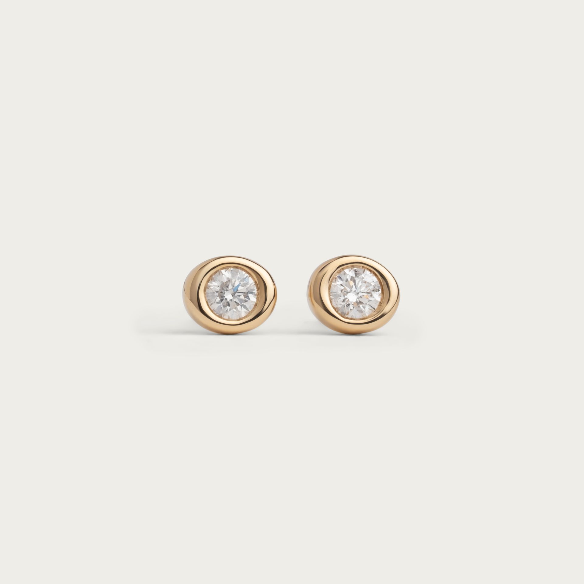 Kimberfire Pebble earrings in yellow gold.