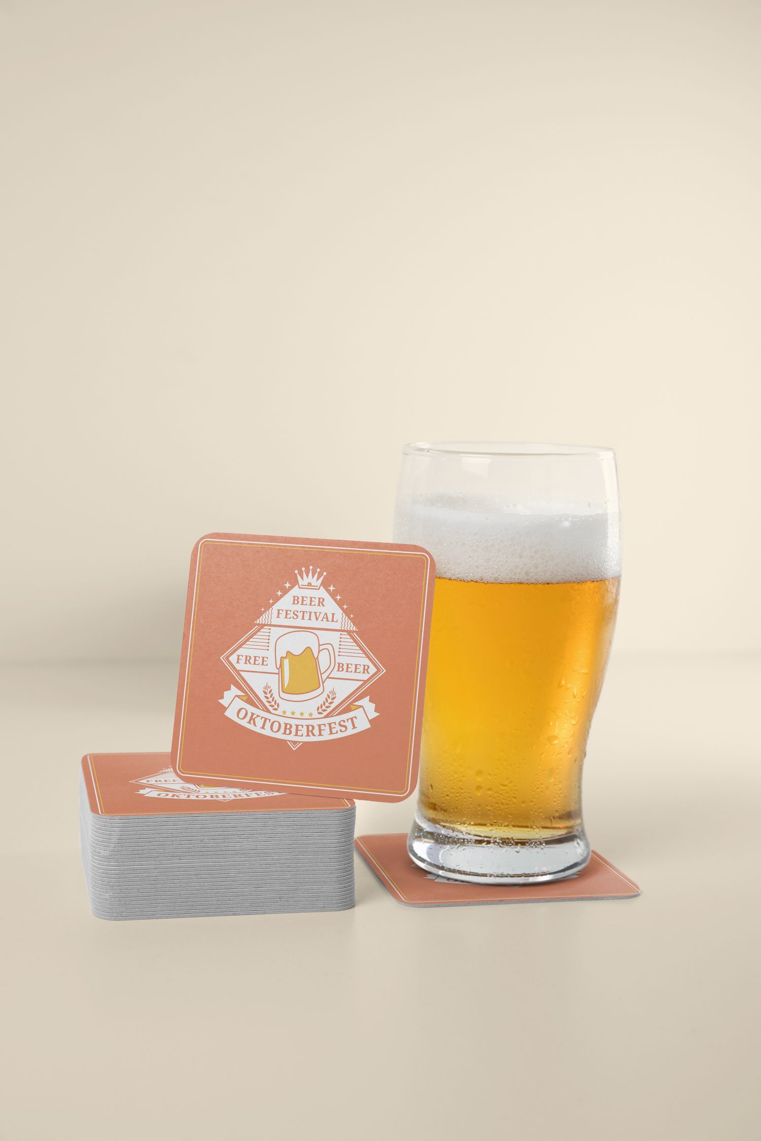 A glass of beer is sitting on a coaster next to a stack of coasters.