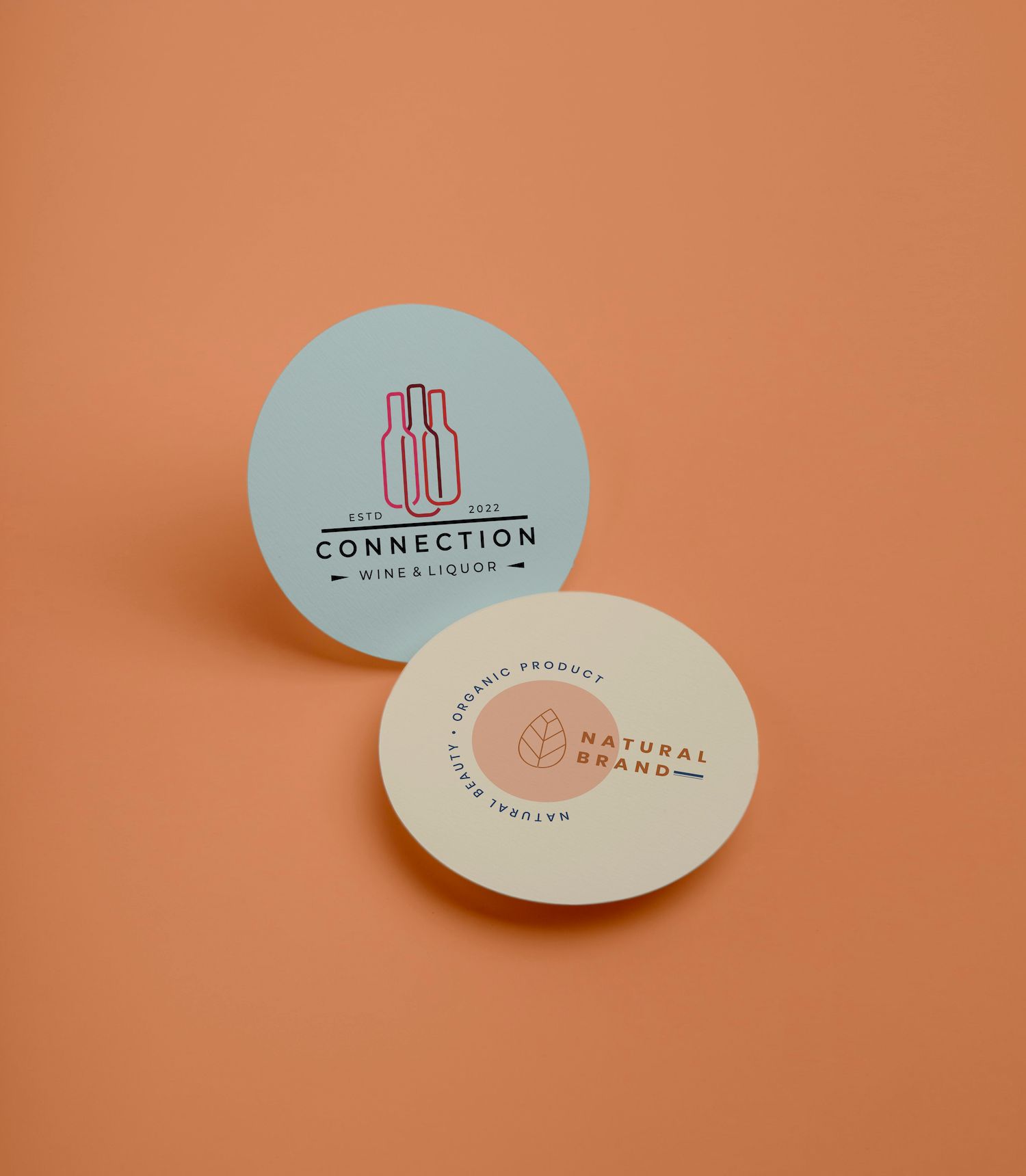 Two circles with a logo on them are sitting on a table.