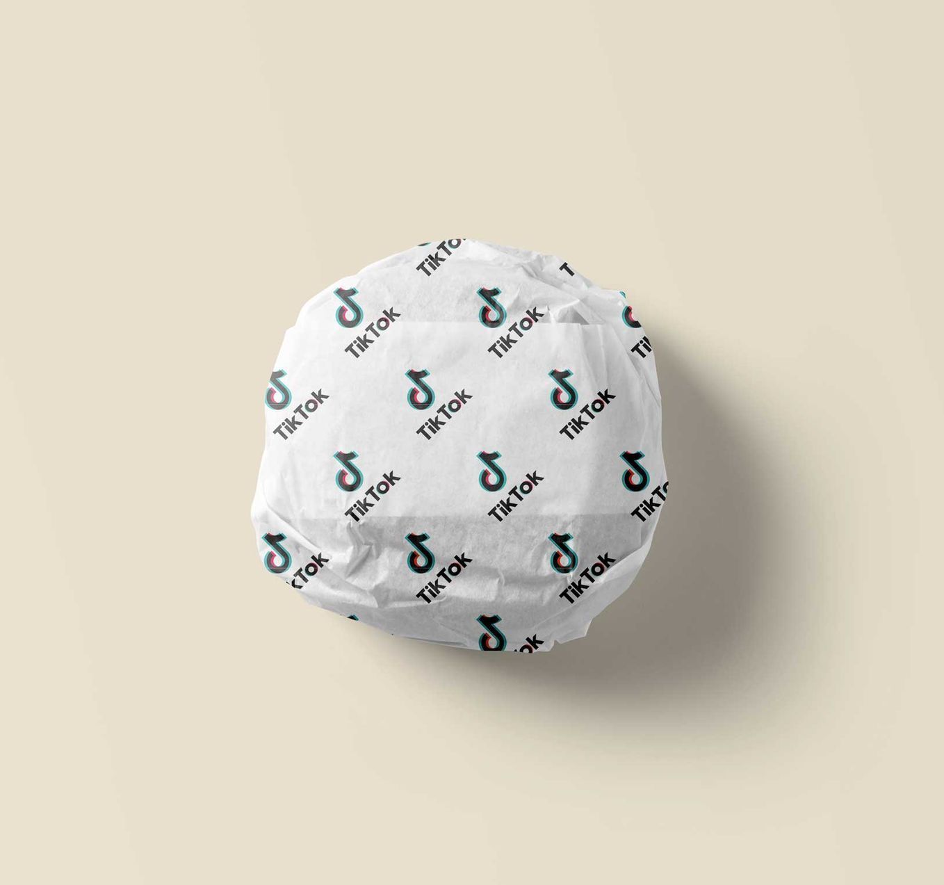 A ball of tik tok wrapping paper is sitting on a table.