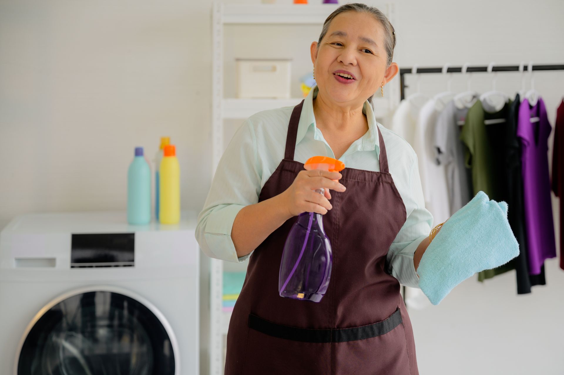 Female maid with a microfiber cloth and cleaner spray used for home cleaning service. Female maid with a microfiber cloth and cleaner spray used for home cleaning service.