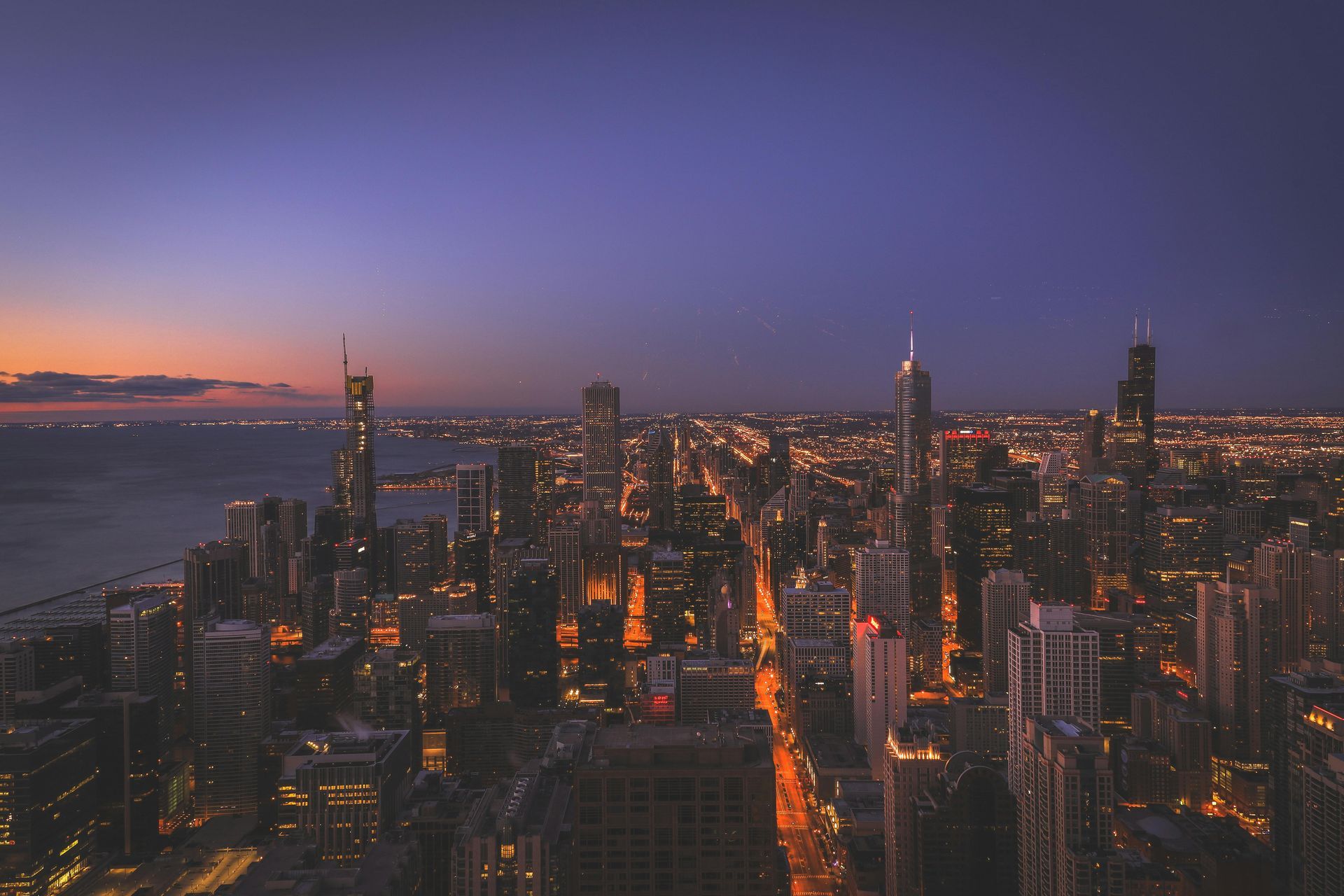 An aerial view of a city skyline at night.