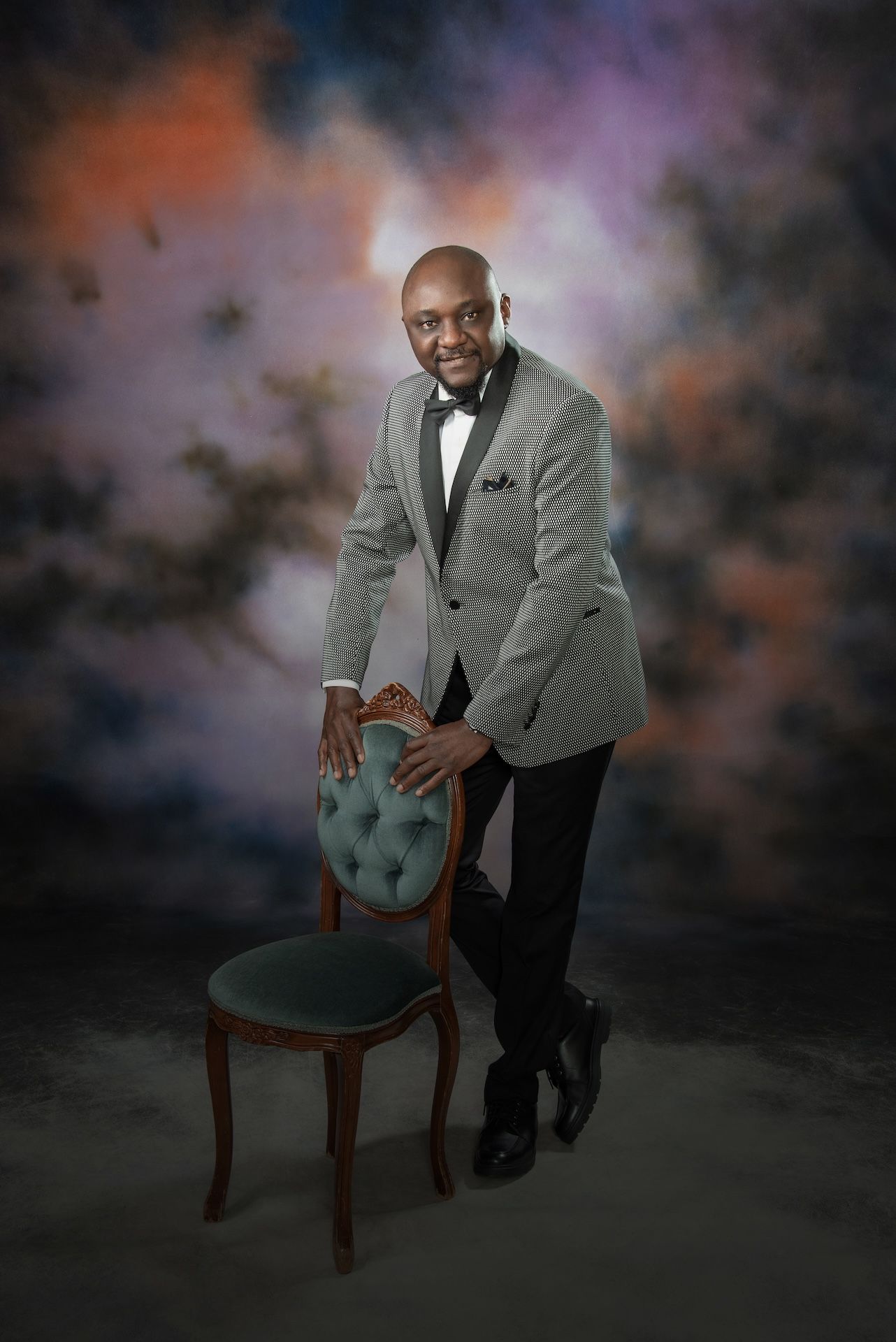 A Man in a Suit and Tie is Sitting Next to a Woman in a Black Dress — Dale Wright Portrait Maker in Shepparton, VIC