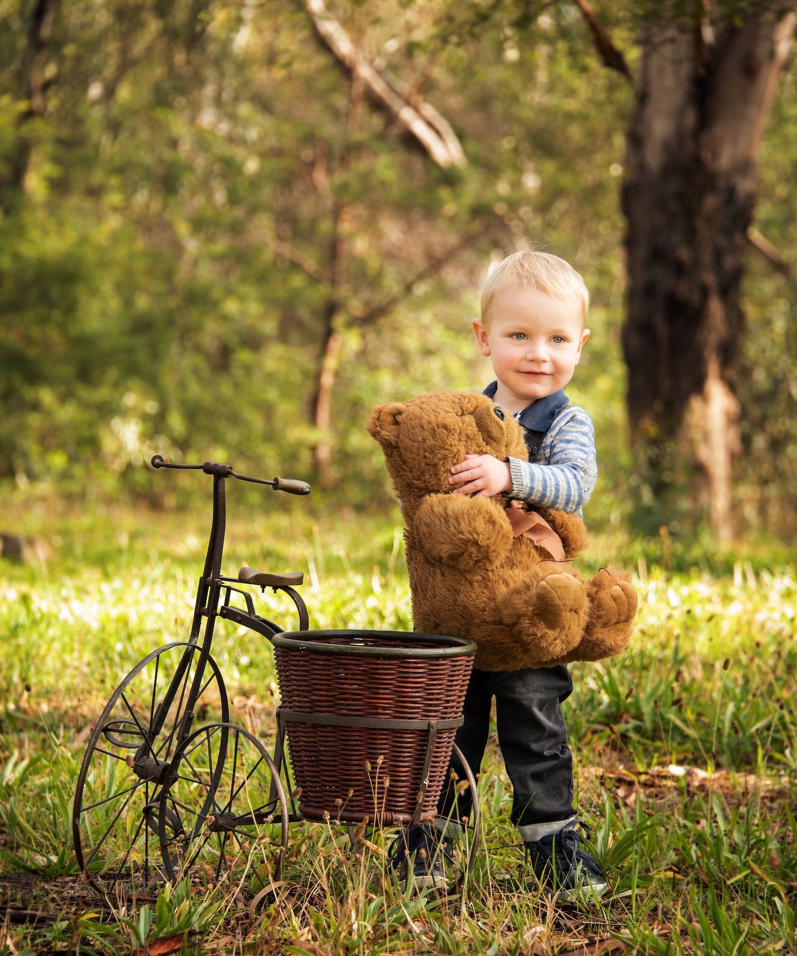 Two Children Are Sitting in a Sleigh With Santa Claus — Dale Wright Portrait Maker in Shepparton, VIC