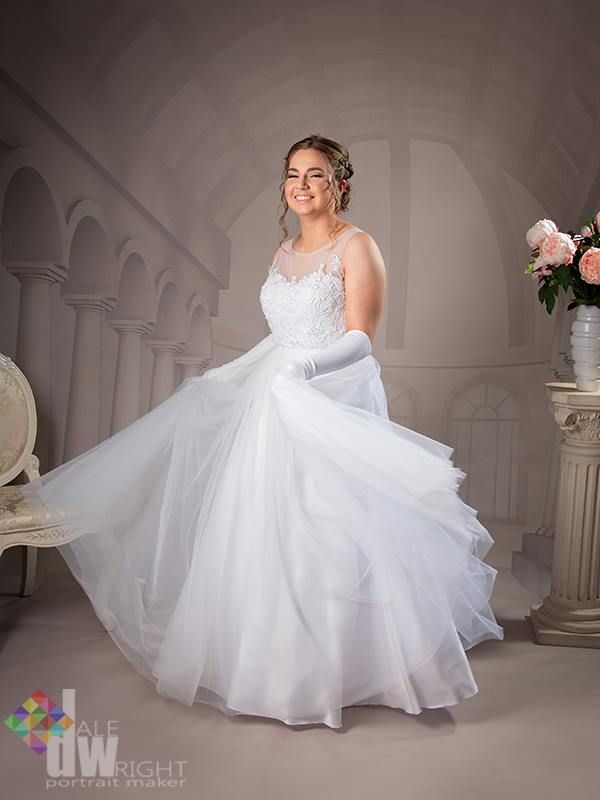 A Woman in a White Dress is Posing for a Picture — Dale Wright Portrait Maker in Shepparton, VIC