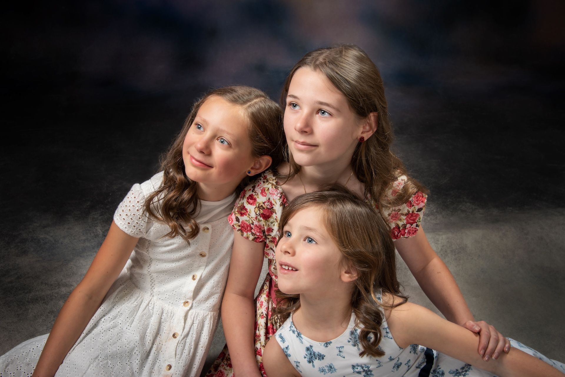 A Family Standing in Front of a Wall of Colorful Balloons — Dale Wright Portrait Maker in Shepparton, VIC