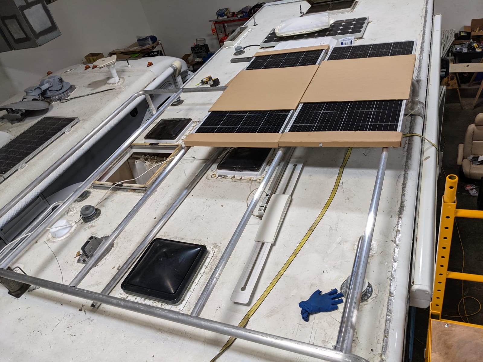 Mid-install of solar panels on an RV roof