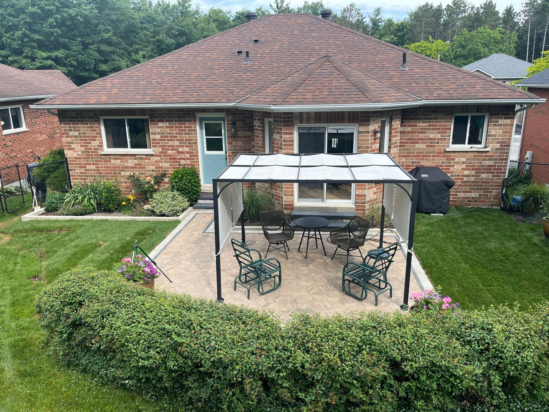 a patio with a circular design and a table and chairs