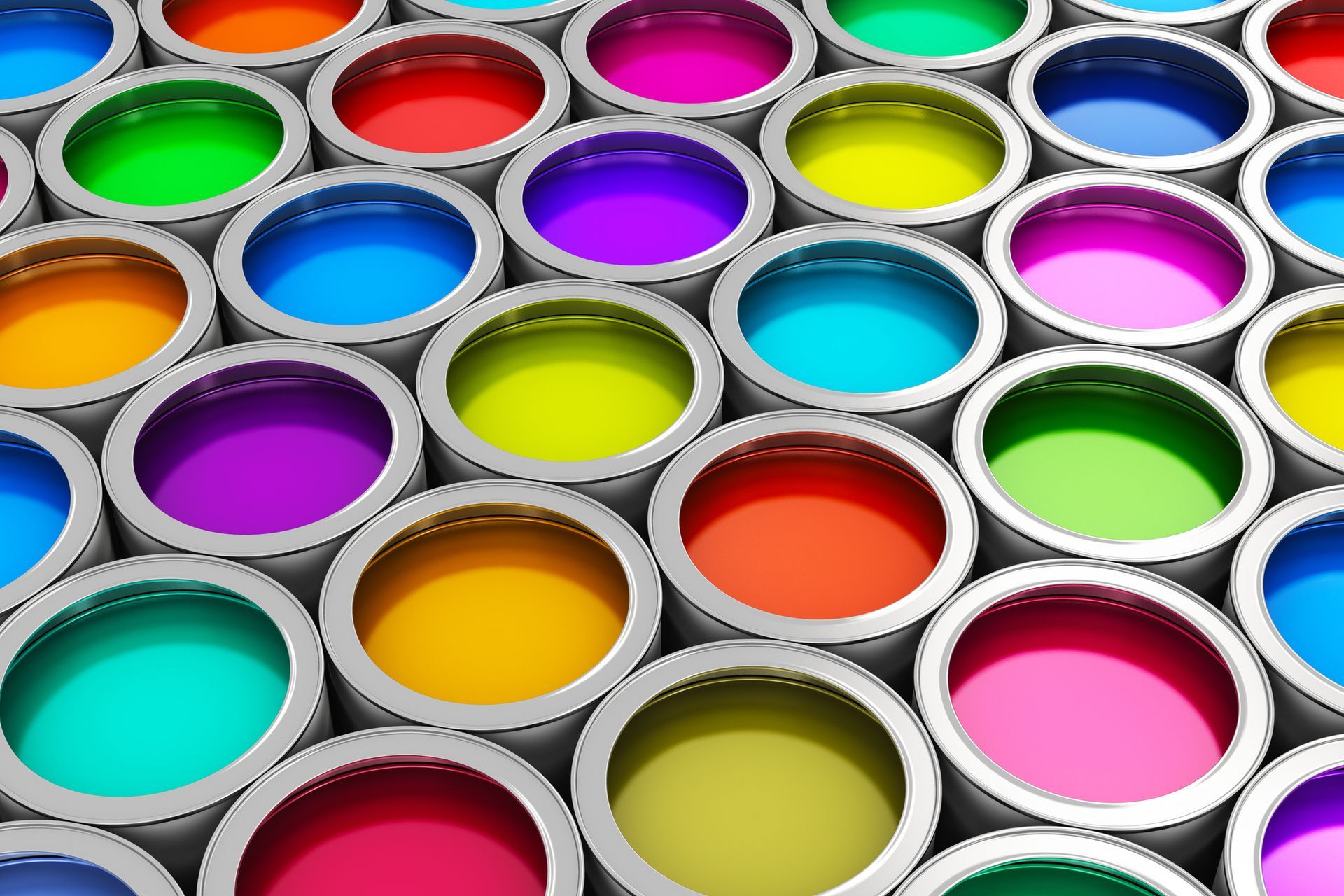 Open paint cans filled with a variety of vibrant colors.