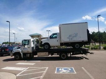 SWFT Towing tow truck towing a commercial truck - Expert towing services for commercial vehicles.