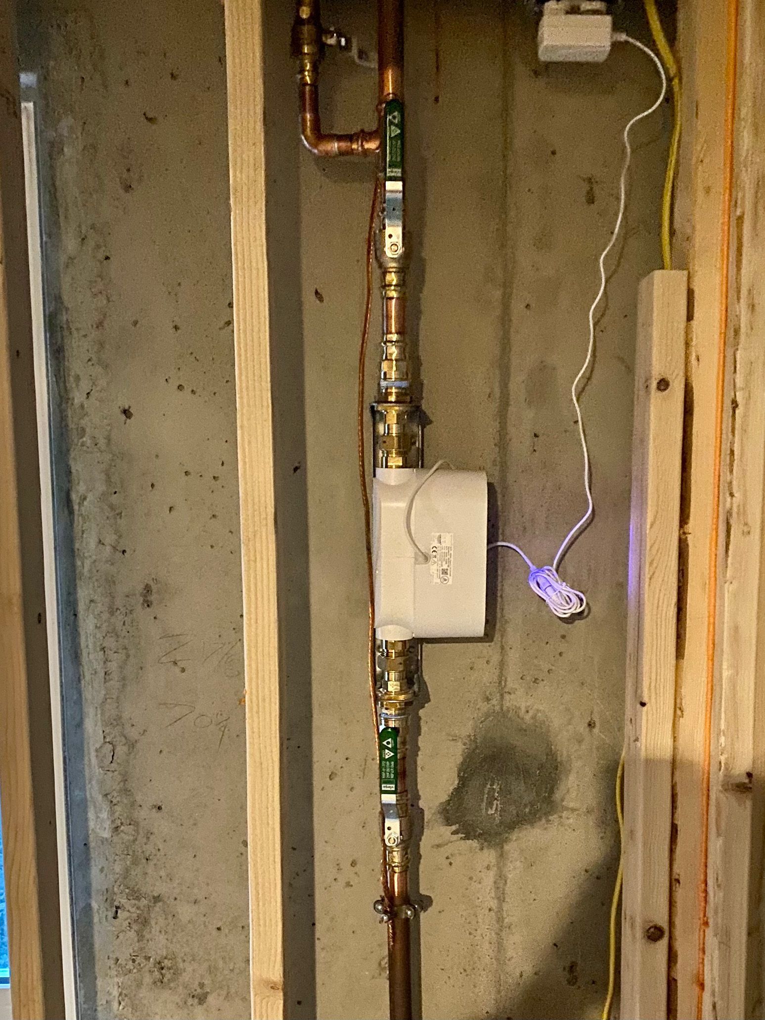 Person using a main water shutoff valve.