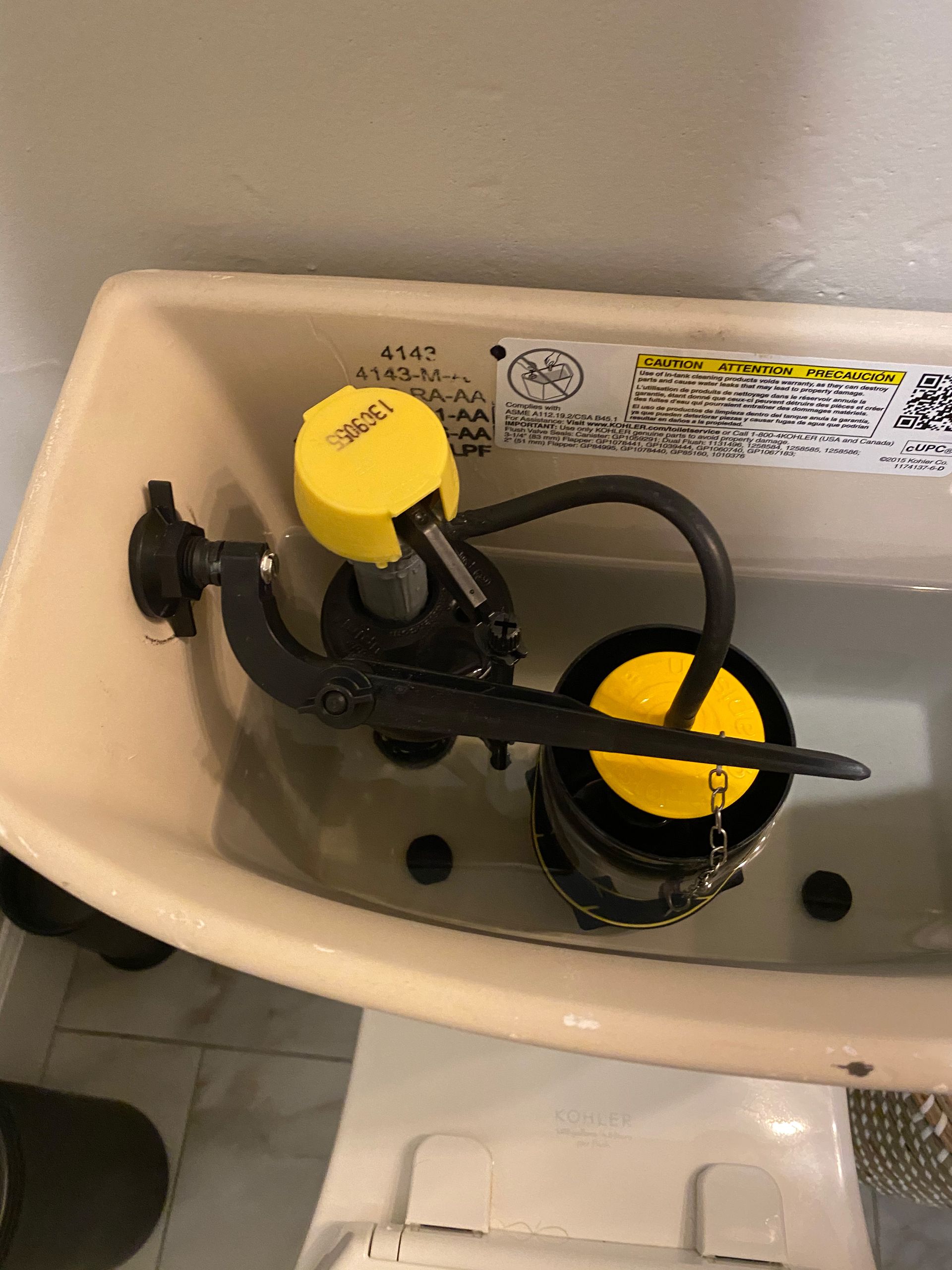 Modtech technician repairing toilet.